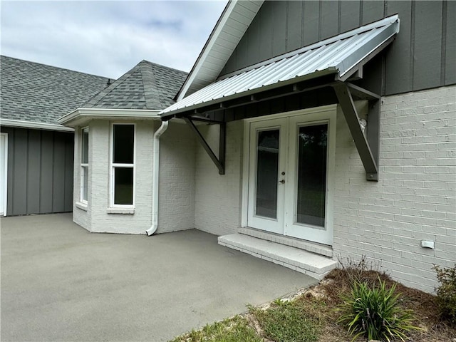 entrance to property with a patio area and french doors