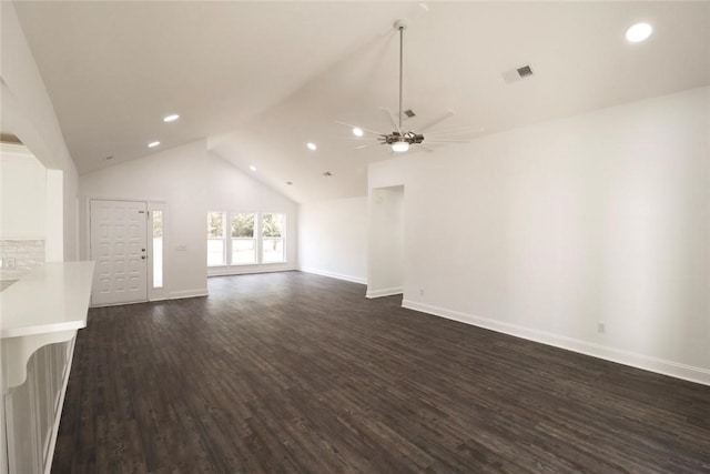 unfurnished living room with high vaulted ceiling, ceiling fan, and dark wood-type flooring