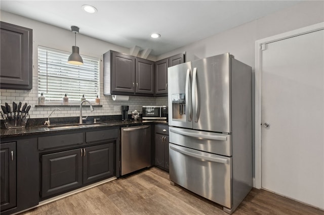 192 W Maple Ave, Kingsland, GA 31548 - kitchen featuring stainless steel appliances, a sink, wood finished floors, backsplash, and recessed lighting