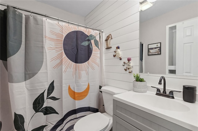 192 W Maple Ave, Kingsland, GA 31548 - bathroom featuring toilet, vanity, a shower with curtain, and wood walls