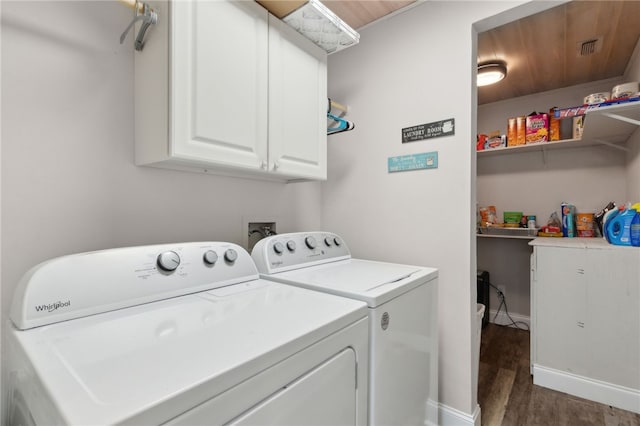192 W Maple Ave, Kingsland, GA 31548 - laundry room featuring washing machine and dryer, wood finished floors, cabinet space, and baseboards
