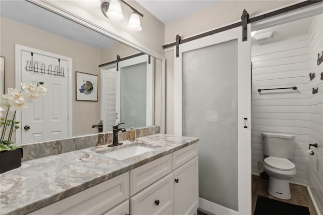 192 W Maple Ave, Kingsland, GA 31548 - bathroom with vanity, toilet, and wood finished floors