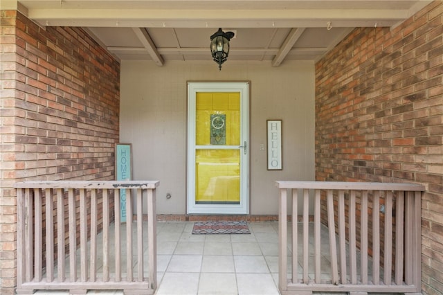 192 W Maple Ave, Kingsland, GA 31548 - property entrance with a porch and brick siding