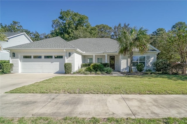 ranch-style house featuring a garage and a front lawn