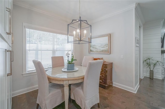 dining space with a notable chandelier, crown molding, and dark wood-type flooring