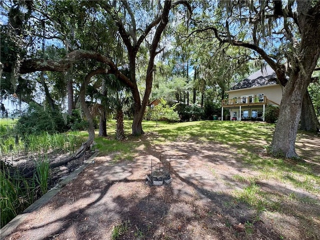 1356 Fiddler Trce NE, Townsend, GA 31331 - view of green lawn featuring a wooden deck