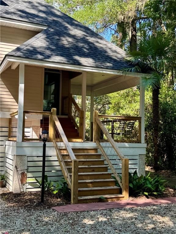 1356 Fiddler Trce NE, Townsend, GA 31331 - doorway to property featuring a shingled roof and covered porch