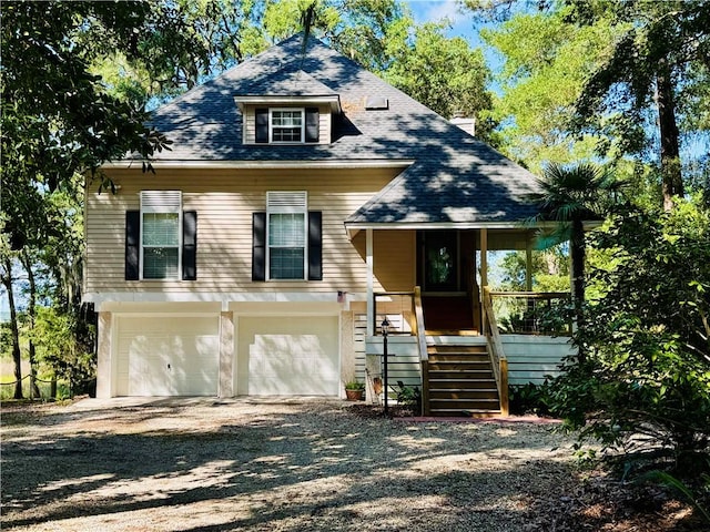 1356 Fiddler Trce NE, Townsend, GA 31331 - view of front of property with dirt driveway, a garage, and stairway