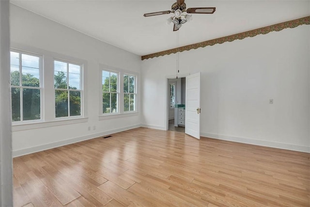 unfurnished bedroom with baseboards, light wood finished floors, and ceiling fan