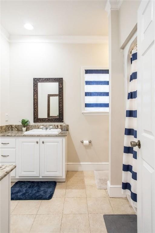 bathroom featuring vanity, tile patterned floors, curtained shower, and ornamental molding