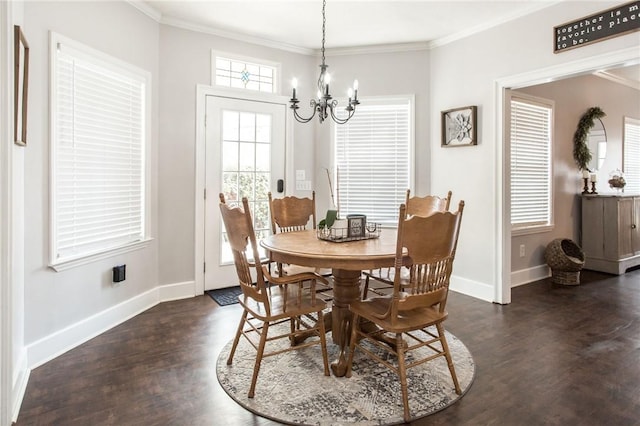 dining area with dark wood-type flooring, crown molding, and a chandelier