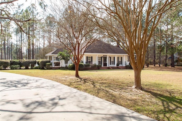 view of front of home with a front lawn and a porch