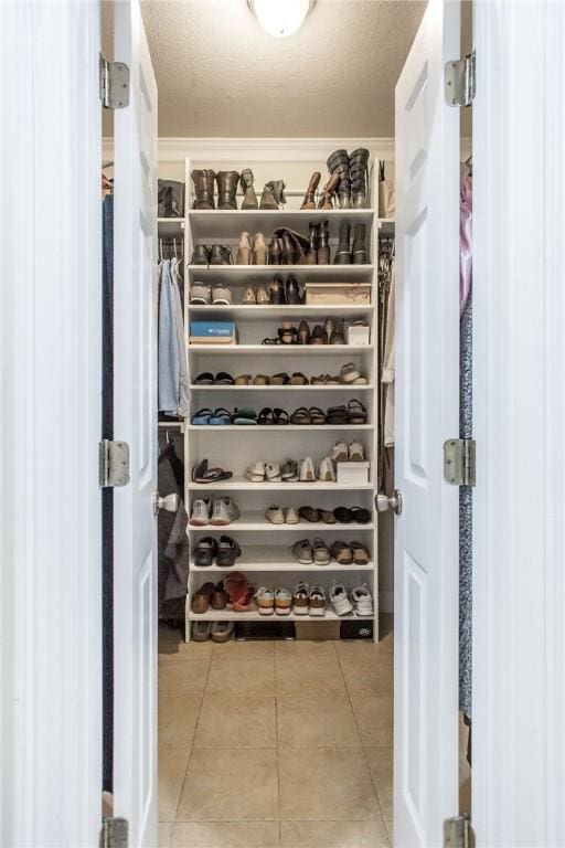 spacious closet with tile patterned flooring