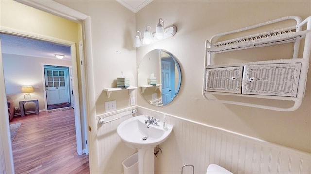 800 Mallery St Unit 3, Saint Simons Island, GA 31522 - bathroom featuring wainscoting, wood finished floors, and ornamental molding