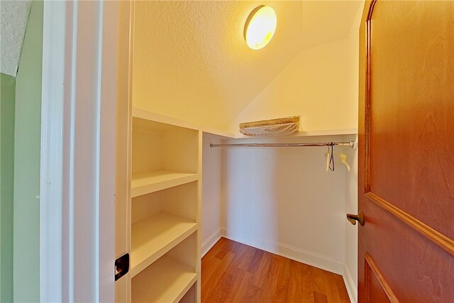 4949 Trudie Rd, Blackshear, GA 31516 - spacious closet with vaulted ceiling and wood finished floors