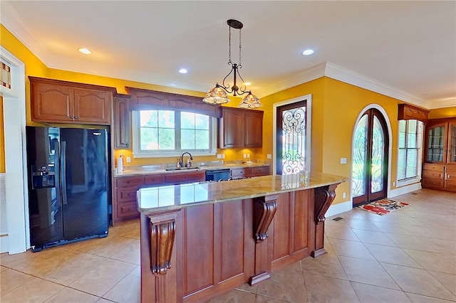 4949 Trudie Rd, Blackshear, GA 31516 - kitchen with black fridge with ice dispenser, light tile patterned flooring, crown molding, decorative light fixtures, and light stone countertops