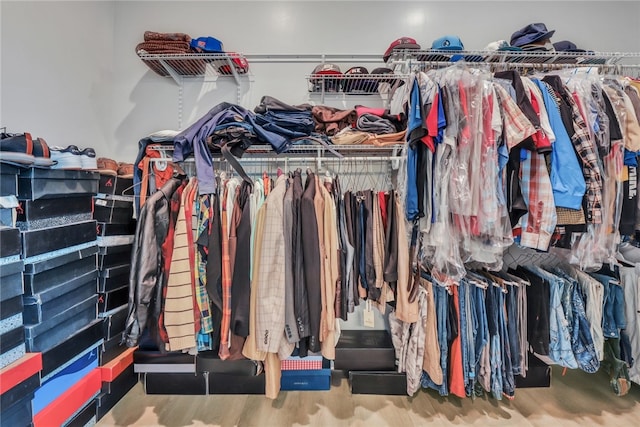 spacious closet featuring hardwood / wood-style floors