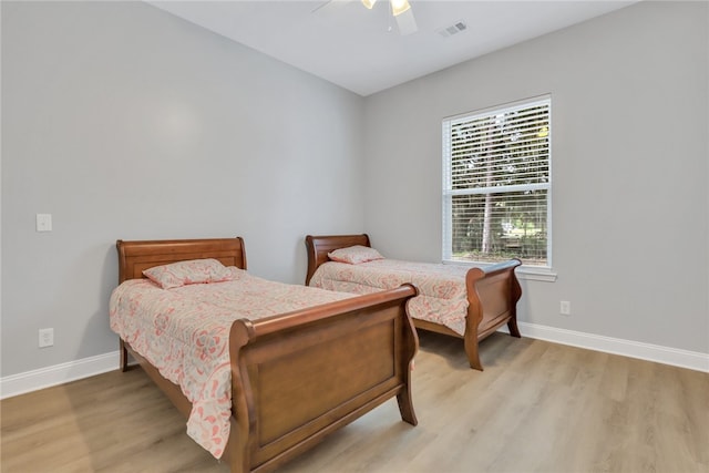 bedroom featuring ceiling fan and light hardwood / wood-style flooring