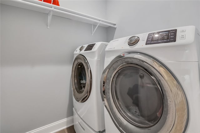 laundry area featuring washing machine and clothes dryer