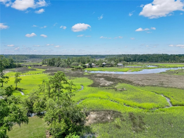 birds eye view of property with a rural view and a water view