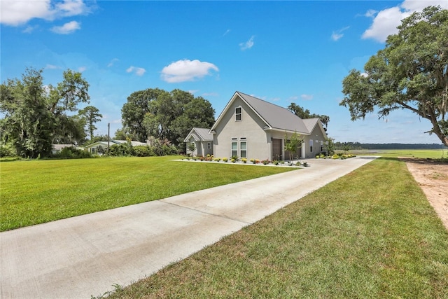 view of side of property with a yard