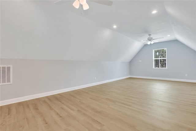 bonus room featuring ceiling fan, lofted ceiling, and light hardwood / wood-style flooring