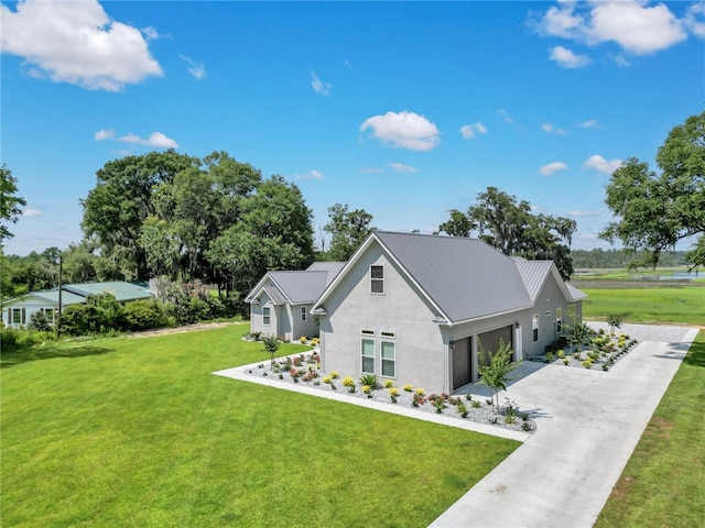 view of front facade featuring a garage and a front lawn