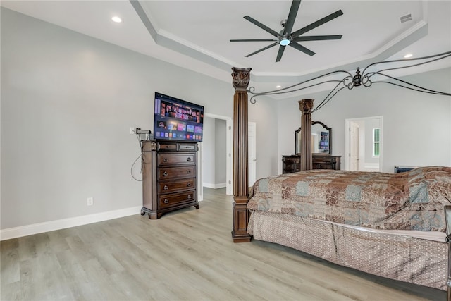 bedroom featuring ceiling fan, crown molding, and light wood-type flooring