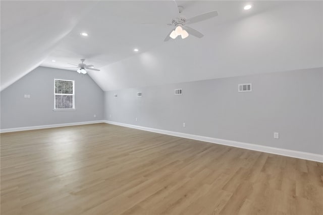 bonus room featuring light hardwood / wood-style floors, vaulted ceiling, and ceiling fan