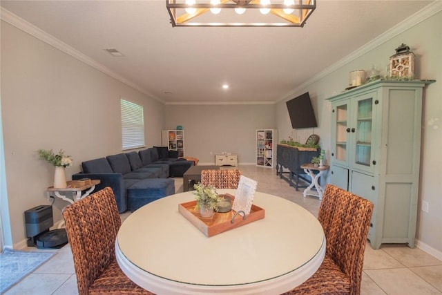 200 Pistachio Ln, Kingsland, GA 31548 - dining space featuring crown molding, a chandelier, and light tile patterned flooring
