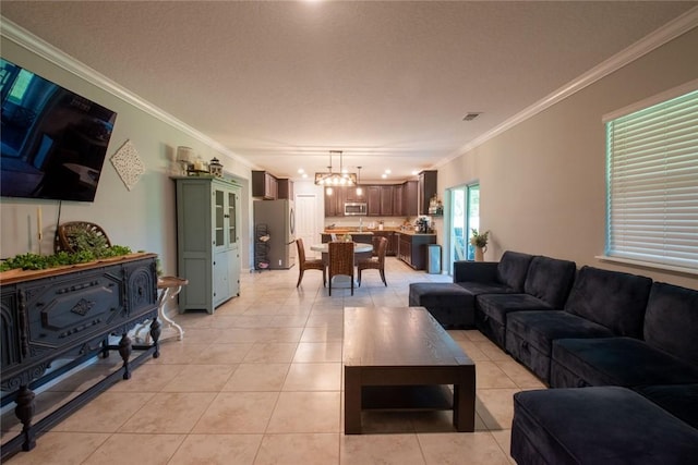 200 Pistachio Ln, Kingsland, GA 31548 - living room featuring a chandelier, ornamental molding, and light tile patterned flooring