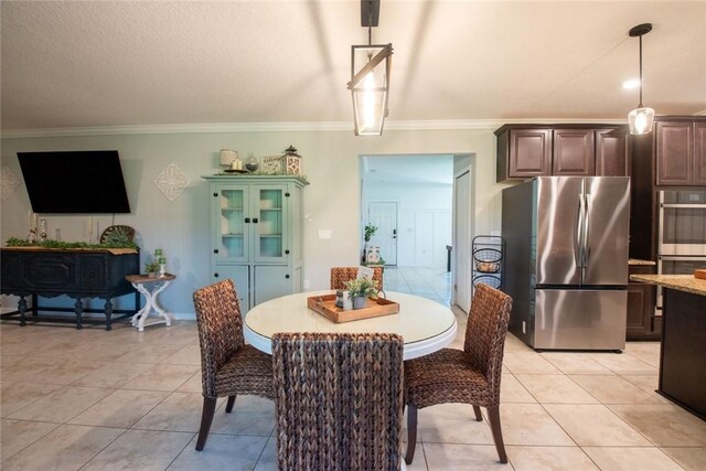 200 Pistachio Ln, Kingsland, GA 31548 - dining space with ornamental molding and light tile patterned floors
