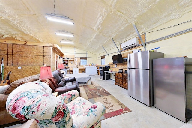 living room with lofted ceiling and a wall mounted air conditioner