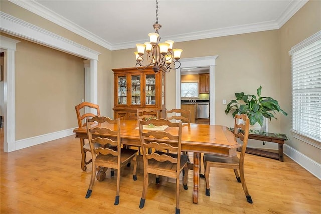 126 Riverwalk Dr, Brunswick, GA 31523 - dining room featuring a chandelier, light wood-style flooring, crown molding, and baseboards