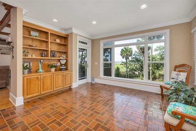 126 Riverwalk Dr, Brunswick, GA 31523 - living room with baseboards, brick floors, crown molding, and recessed lighting