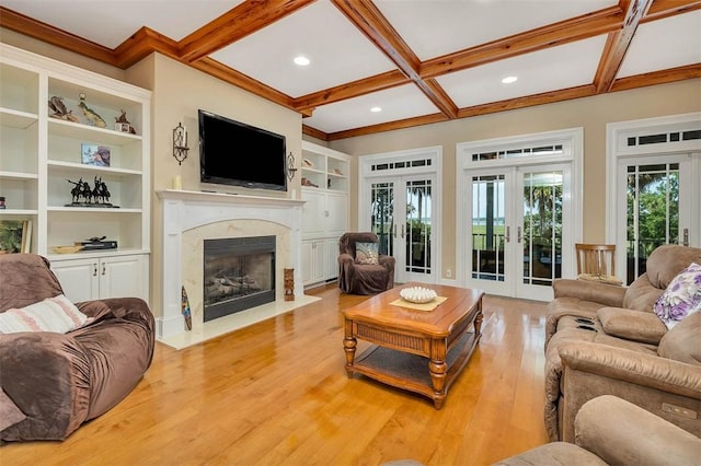 126 Riverwalk Dr, Brunswick, GA 31523 - living area with french doors, coffered ceiling, light wood-type flooring, a premium fireplace, and recessed lighting