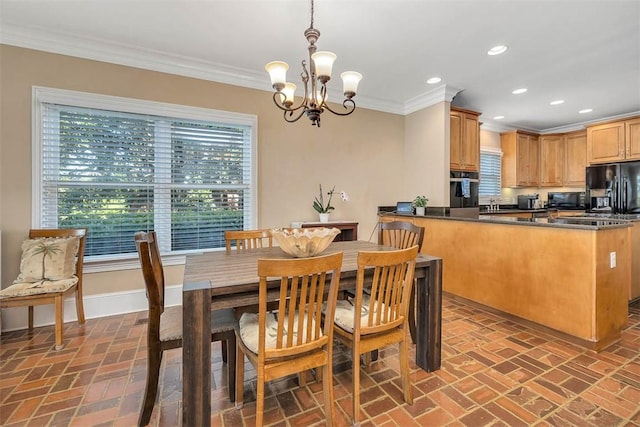126 Riverwalk Dr, Brunswick, GA 31523 - dining room featuring brick floors, crown molding, baseboards, a chandelier, and recessed lighting