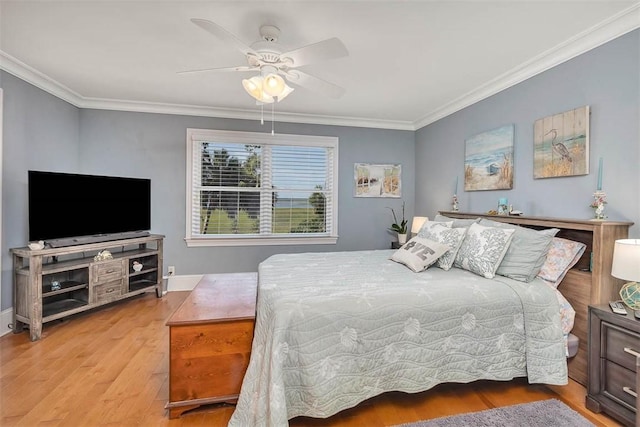 126 Riverwalk Dr, Brunswick, GA 31523 - bedroom with wood finished floors, ornamental molding, a ceiling fan, and baseboards