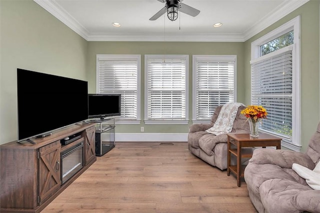 126 Riverwalk Dr, Brunswick, GA 31523 - living room featuring light wood-style flooring, a ceiling fan, crown molding, baseboards, and recessed lighting