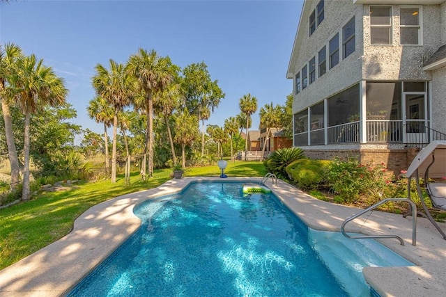 126 Riverwalk Dr, Brunswick, GA 31523 - outdoor pool featuring a sunroom and a yard