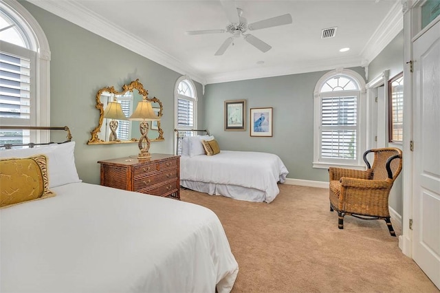 bedroom featuring multiple windows, ornamental molding, light colored carpet, and ceiling fan