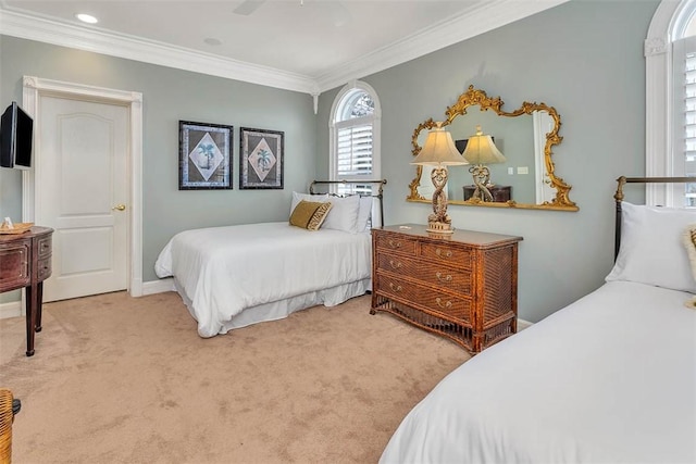 bedroom with ornamental molding and carpet floors