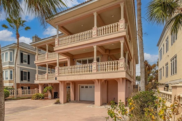 view of front of property with a balcony and a garage