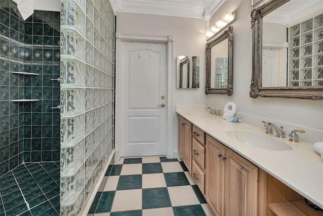 bathroom featuring crown molding, tiled shower, and vanity