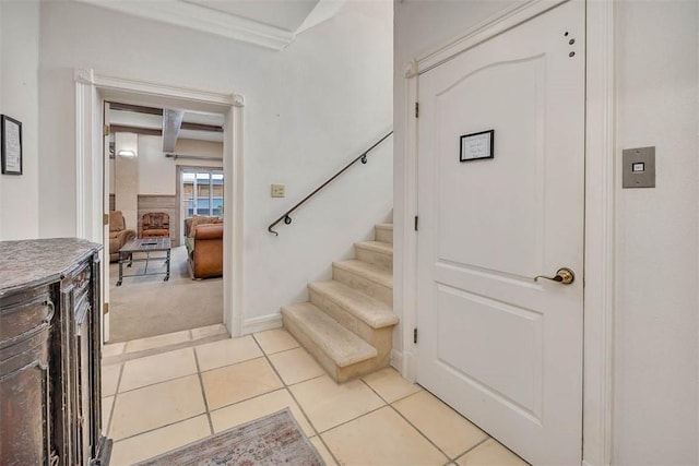 staircase featuring tile patterned flooring