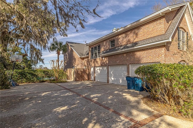 view of side of property featuring a garage