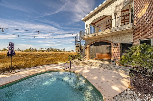 view of pool featuring a patio area