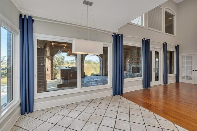 interior space with crown molding and hardwood / wood-style floors