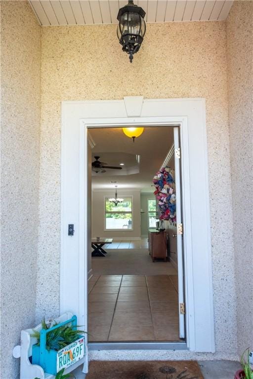 entrance to property with stucco siding
