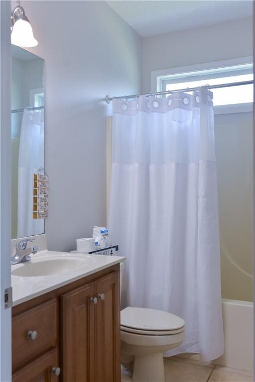 bathroom featuring toilet, shower / bath combo with shower curtain, tile patterned flooring, and vanity